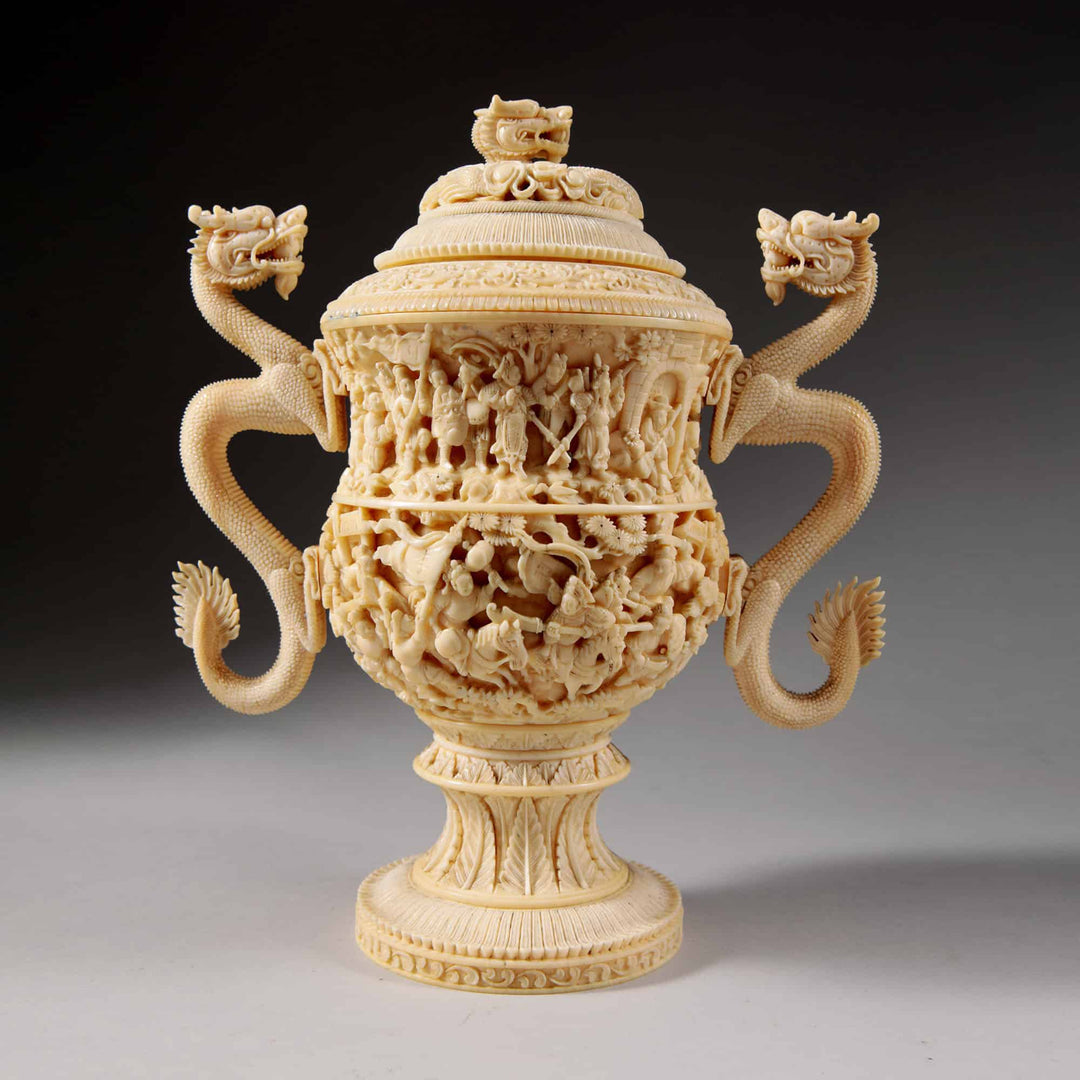 A carved Koro cup and cover with dragon-handles and figures in relief, China, Qing Dynasty,