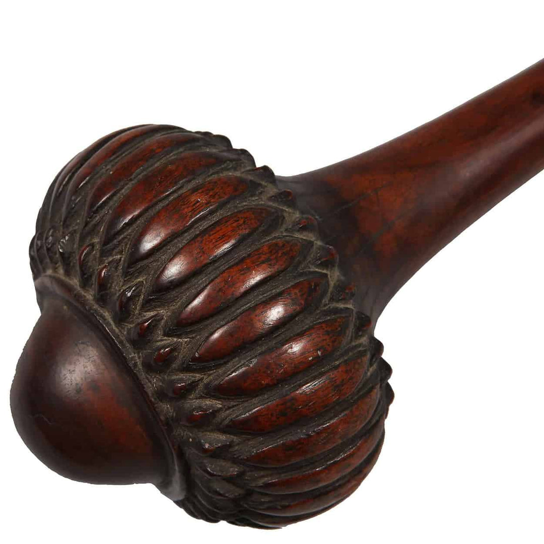 Close-up of intricately carved wooden head of Ula Fijian War Club – Ethnographic Oceanic Throwing Club with dark polished finish