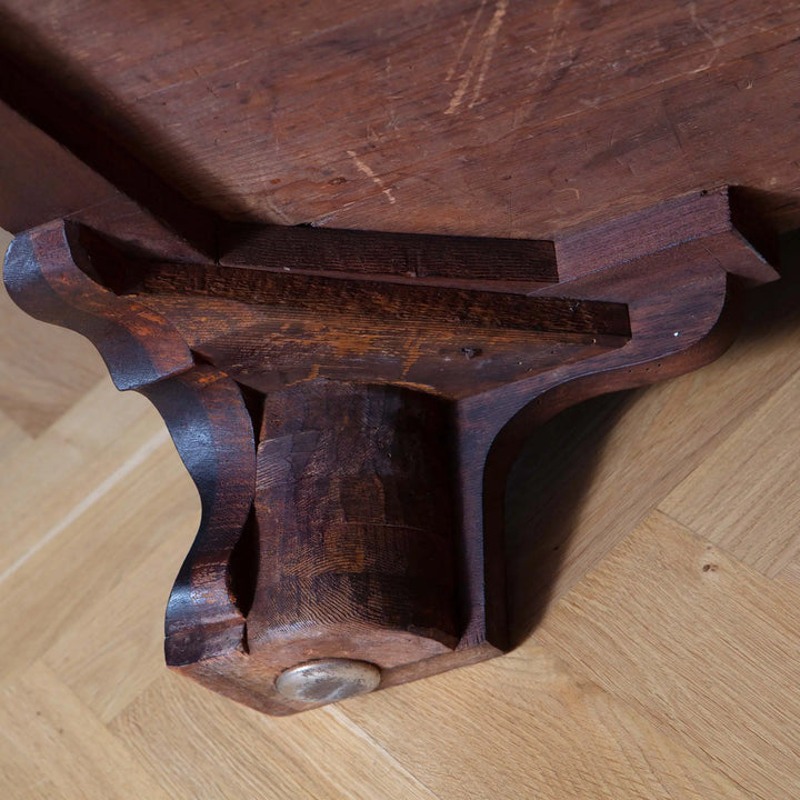 Close-up of the carved ogee bracket foot on the George III Chippendale Mahogany Serpentine Commode.