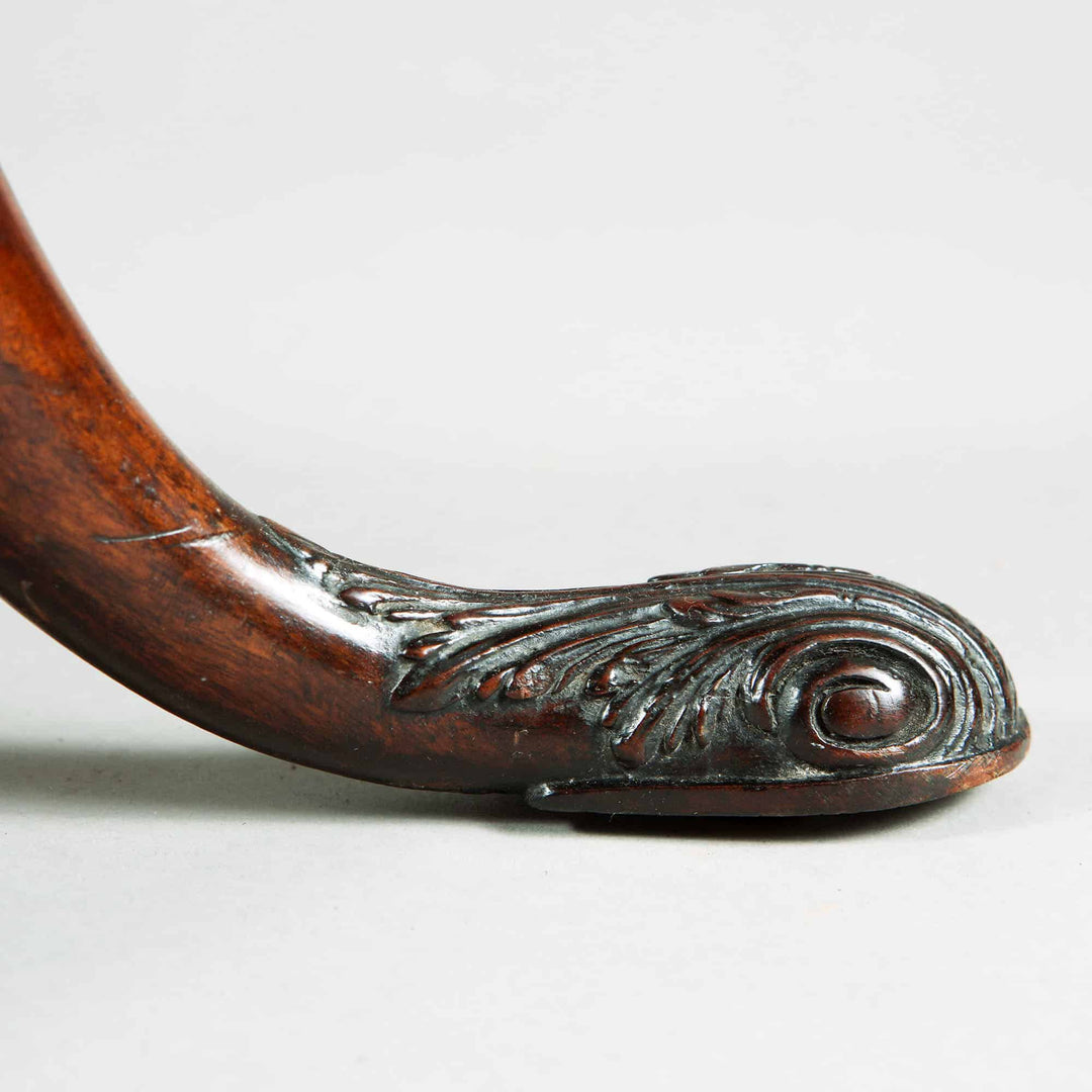 Carved cabriole leg detail with marine shell and acanthus motifs on George III Mahogany Tripod Table.