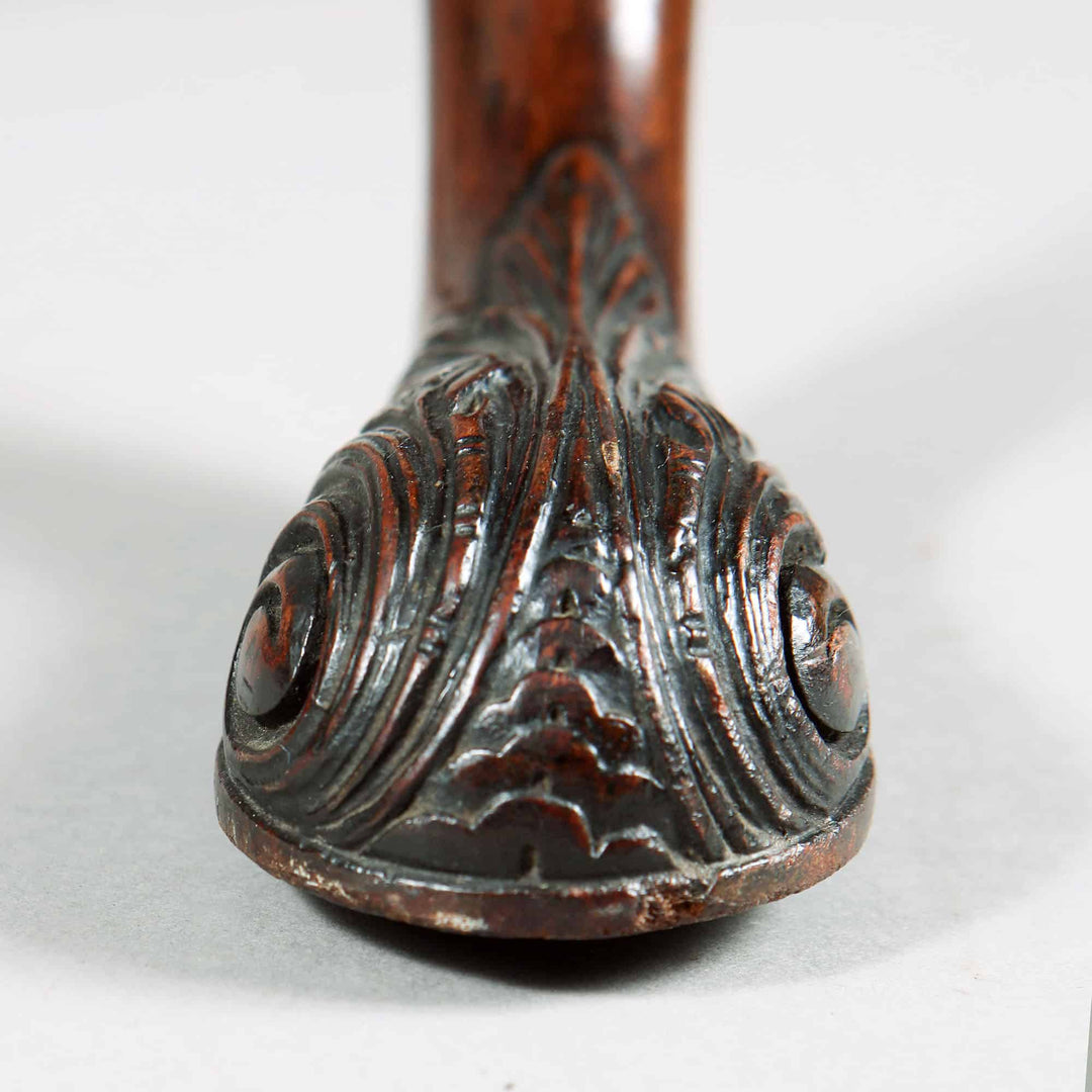 Close-up of intricately carved cabriole leg detail on George III Mahogany Tripod Table circa 1765.