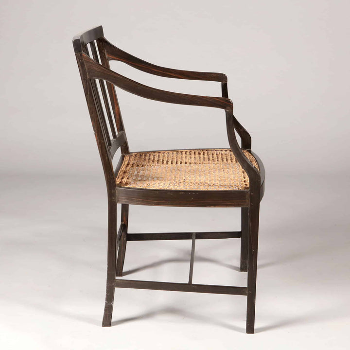 Solid ebony Anglo Indian dining chair with caned seat and elegant spindle back by Collection EE30