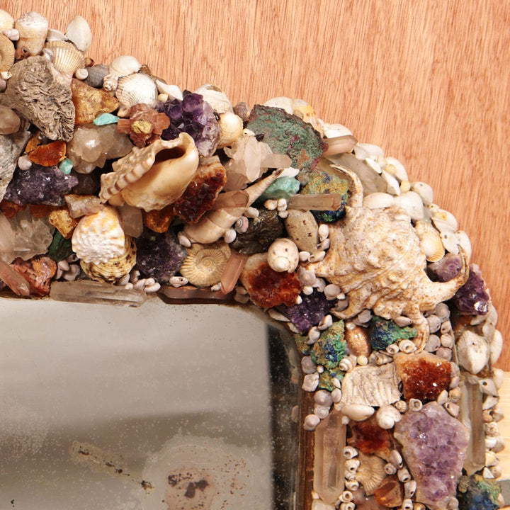 Vintage Crystal and Shell Grotto Mirror with shells, corals, stones, fossils, and polished agate on giltwood frame.