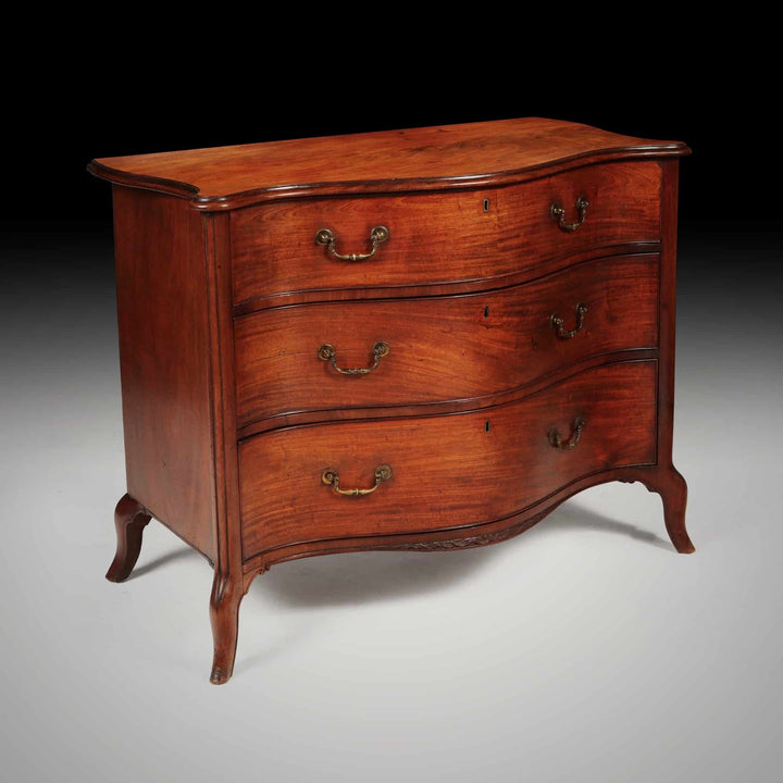 George III serpentine chest of drawers by Henry Hill of Marlborough in mahogany with brass handles Collection CK20