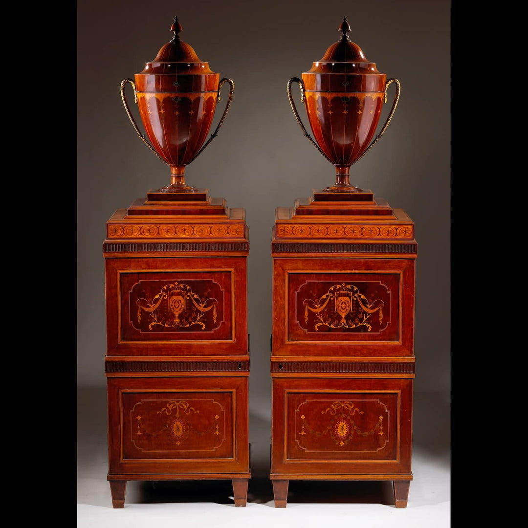 Pair of George III Sheraton Knife Urns on Stands, late 18th century English wooden urns with intricate inlay.