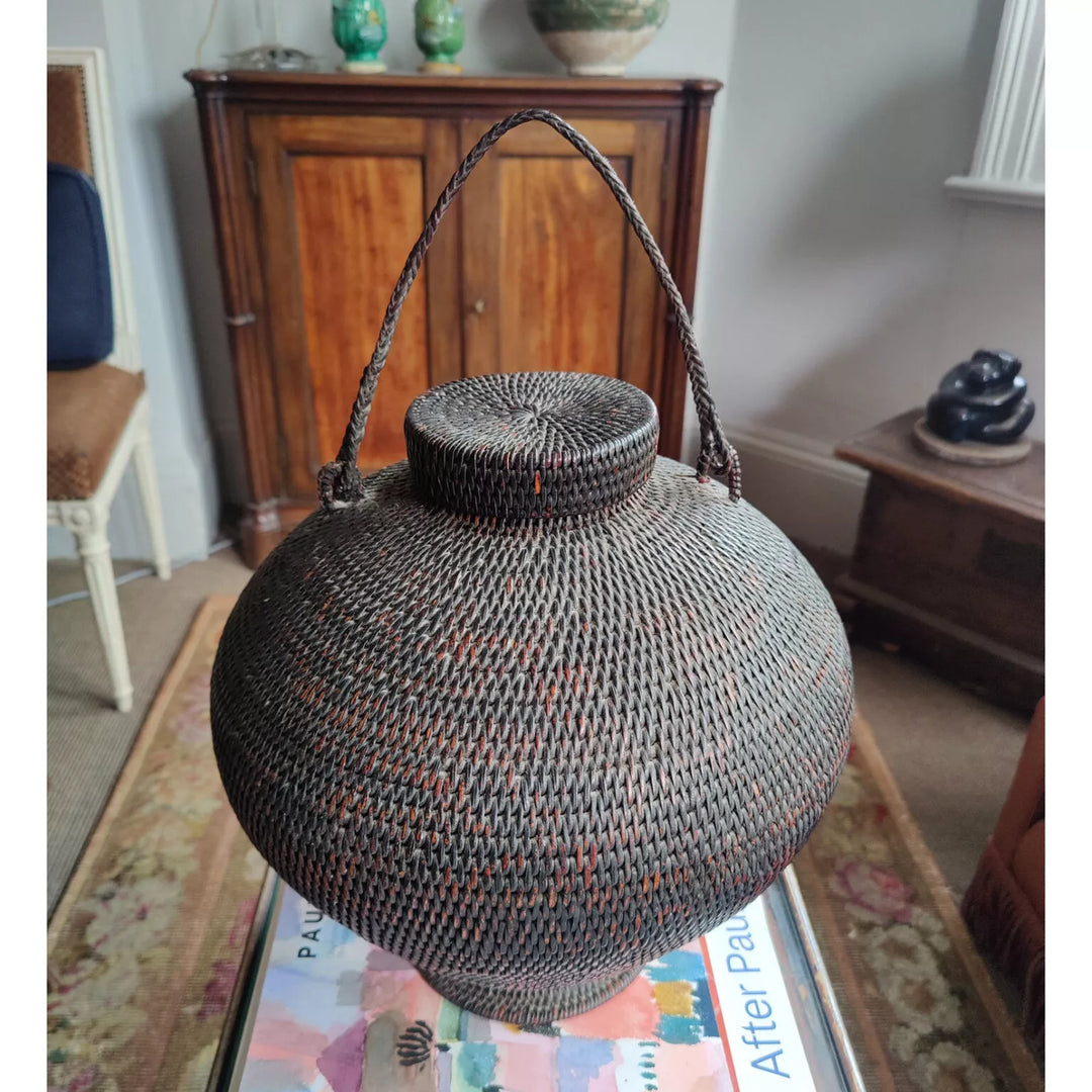 Ifugao “Gor-Bun” Rattan Basket with Lid, coiled design, pedestal base, twisted fiber handle, early 20th century Philippines.