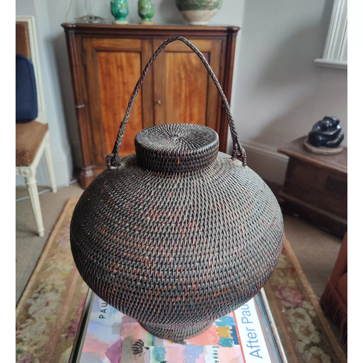 Ifugao “Gor-Bun” Rattan Basket with Lid, coiled design, pedestal base, twisted fiber handle, early 20th century Philippines.