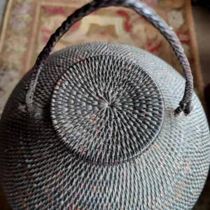 Ifugao “Gor-Bun” Rattan Basket with Lid showing coiled weaving, pedestal base, round body, and twisted fiber handles.