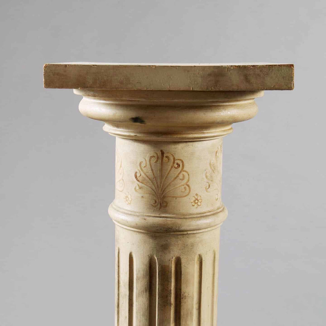 Pair of mid century faux marble painted column pedestals with intricate carved detailing for antique sculpture display.