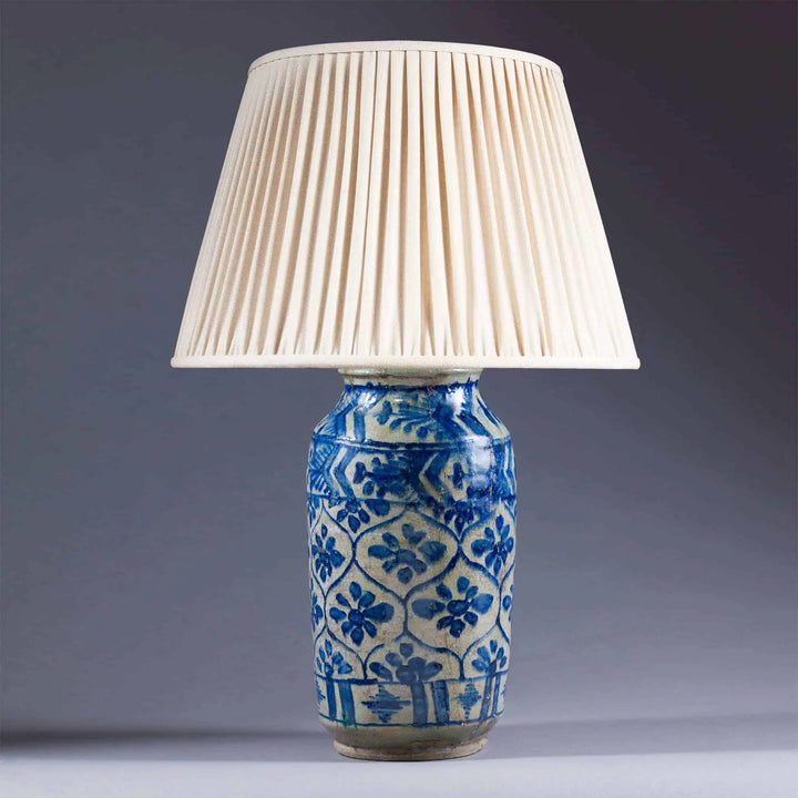 Qajar pottery Vase mounted as a Lamp with blue floral geometric patterns on a glazed biscuit base circa 1850.