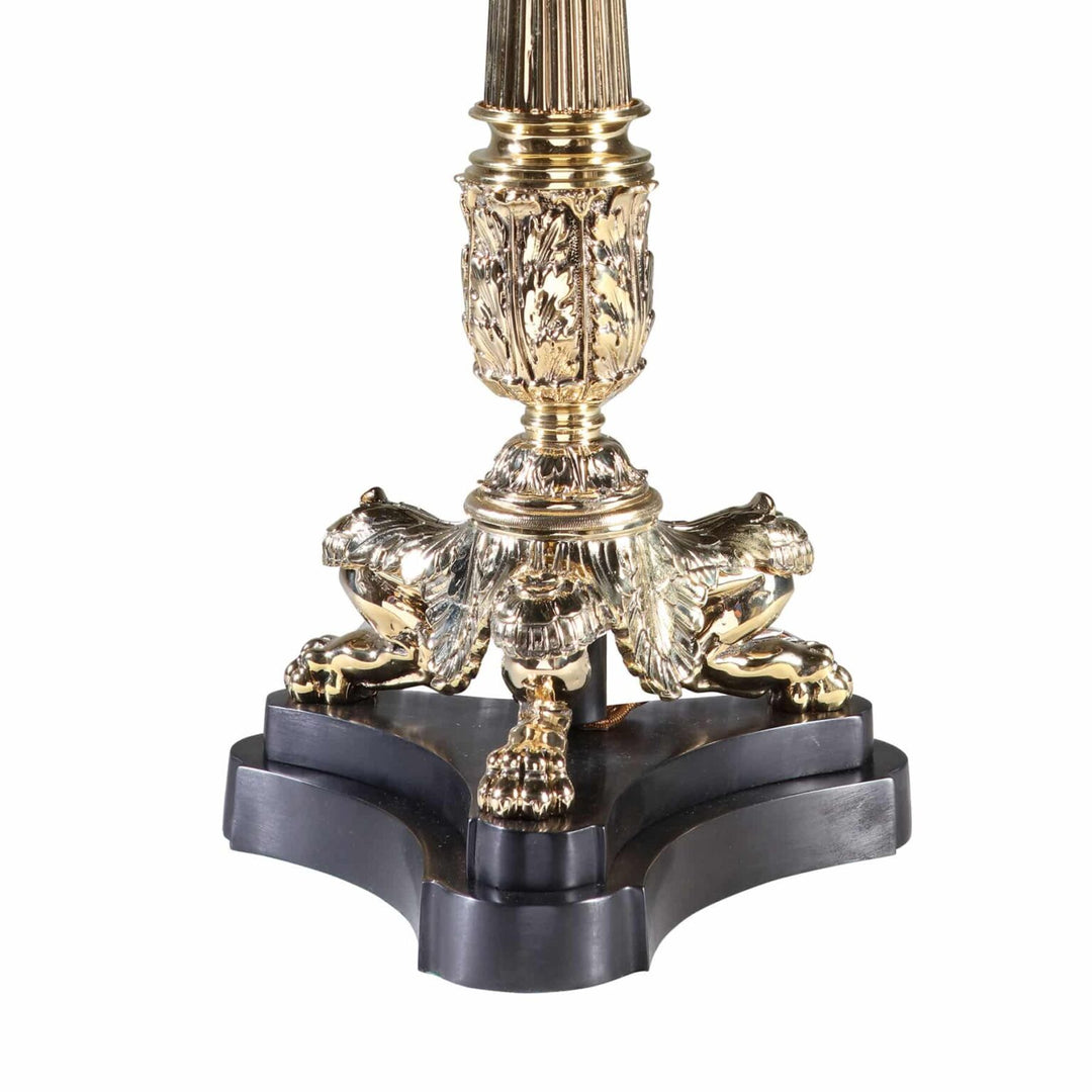 A Polished Brass Column Tripod Table Lamp AJ3 with detailed brass base and black wooden tripod stand circa 1980 England.