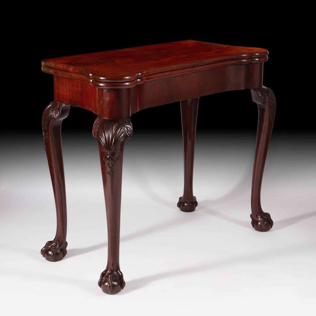 George III Mahogany Card Table with cabriole legs, ball and claw feet, and scallop shell carvings, circa 1770.