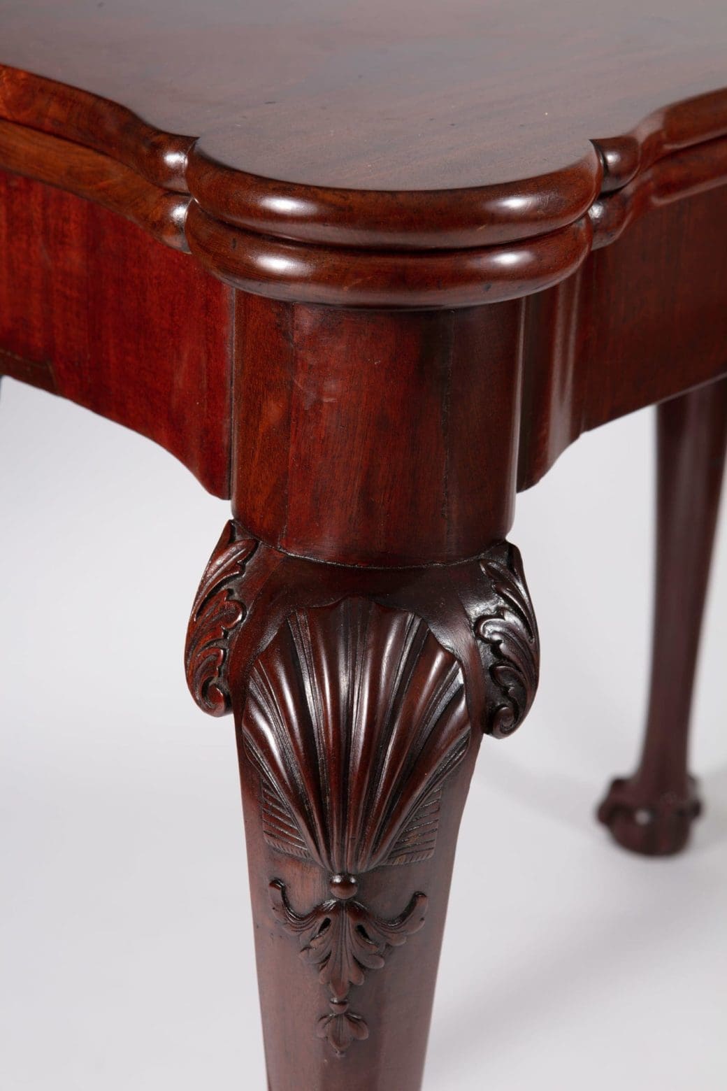George III Mahogany Card Table with carved scallop shells on cabriole legs and rich mahogany finish.