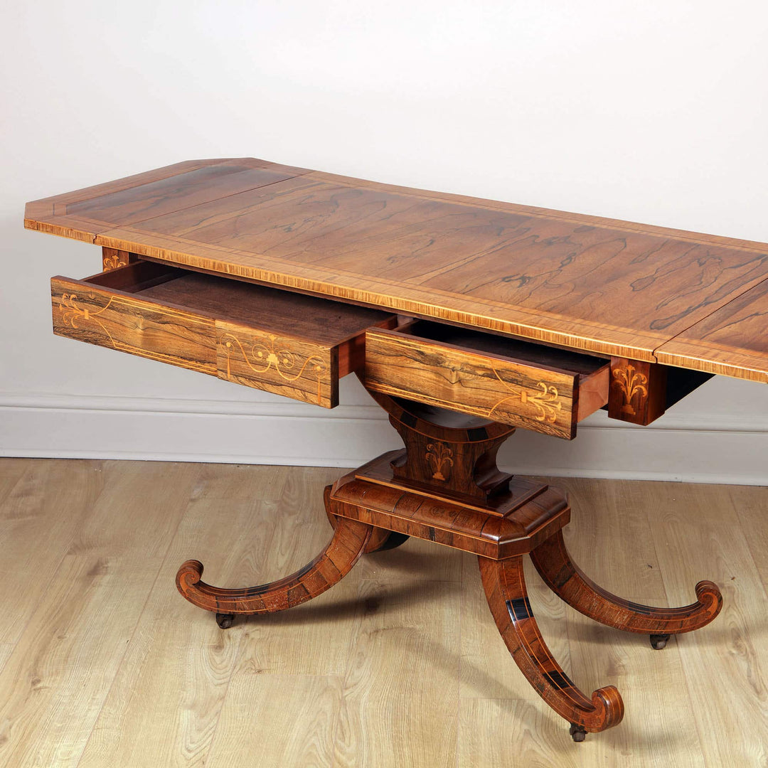 George III Rosewood & Kingwood Sofa Table with ornate drawers and elegantly curved legs, British Isles circa 1820.