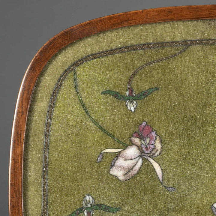 Oval table with beadwork top featuring irises on green variegated ground and stained beech frame circa 1900.