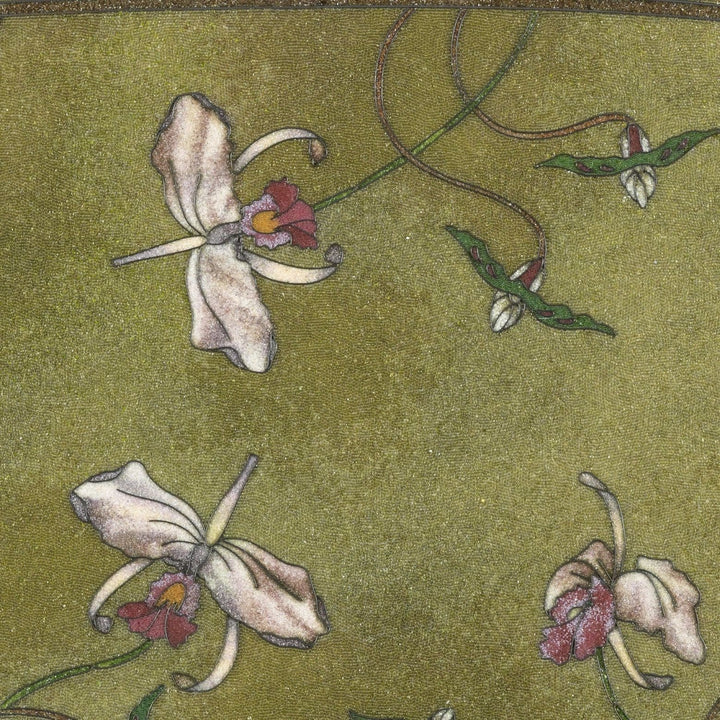 Oval table with beadwork top featuring iris floral design on variegated green background circa 1900.