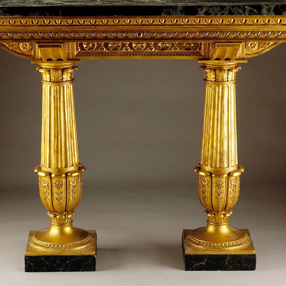 Genoese Giltwood Console Table Attributed to Leopoldo Pollack with Verde Antico marble top and fluted gilt columns.