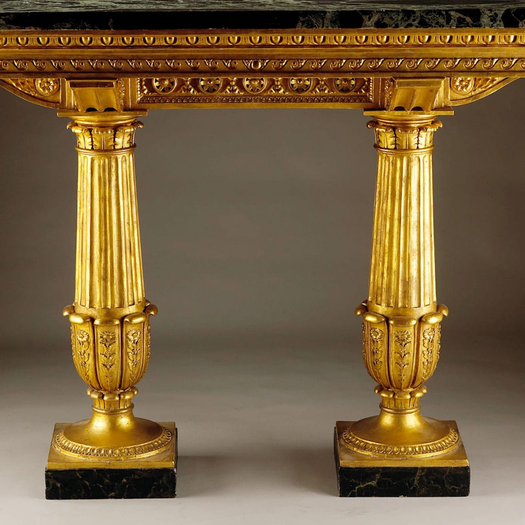 Genoese Giltwood Console Table Attributed to Leopoldo Pollack with Verde Antico marble top and fluted gilt columns.