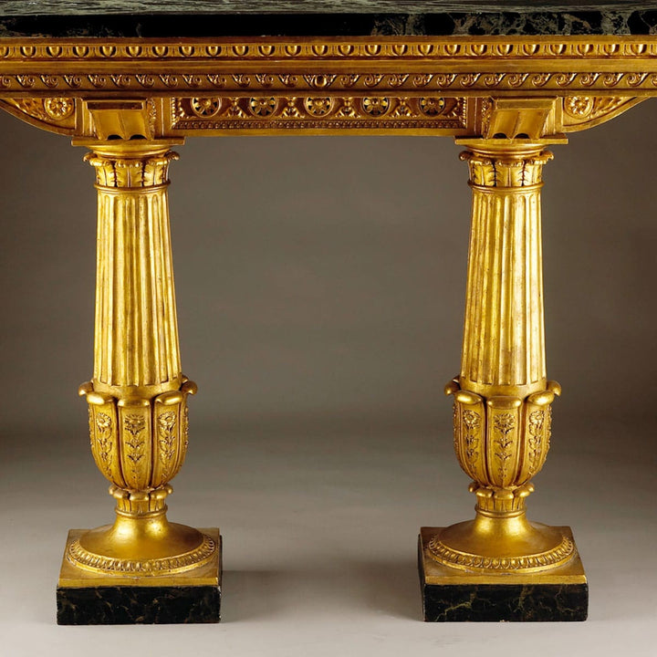 Genoese Giltwood Console Table Attributed to Leopoldo Pollack with Verde Antico marble top and fluted gilt columns.