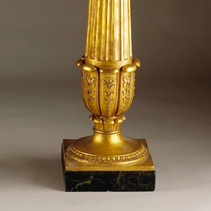 Genoese Giltwood Console Table Attributed to Leopoldo Pollack fluted gilt column base with petal and foliate details on black marble plinth