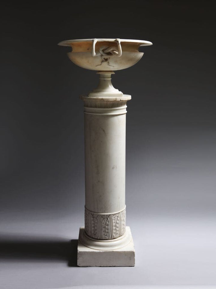 Lorenzo Bartolini Neo-Classical marble tazza with entwined snake handles on a decorated column pedestal.