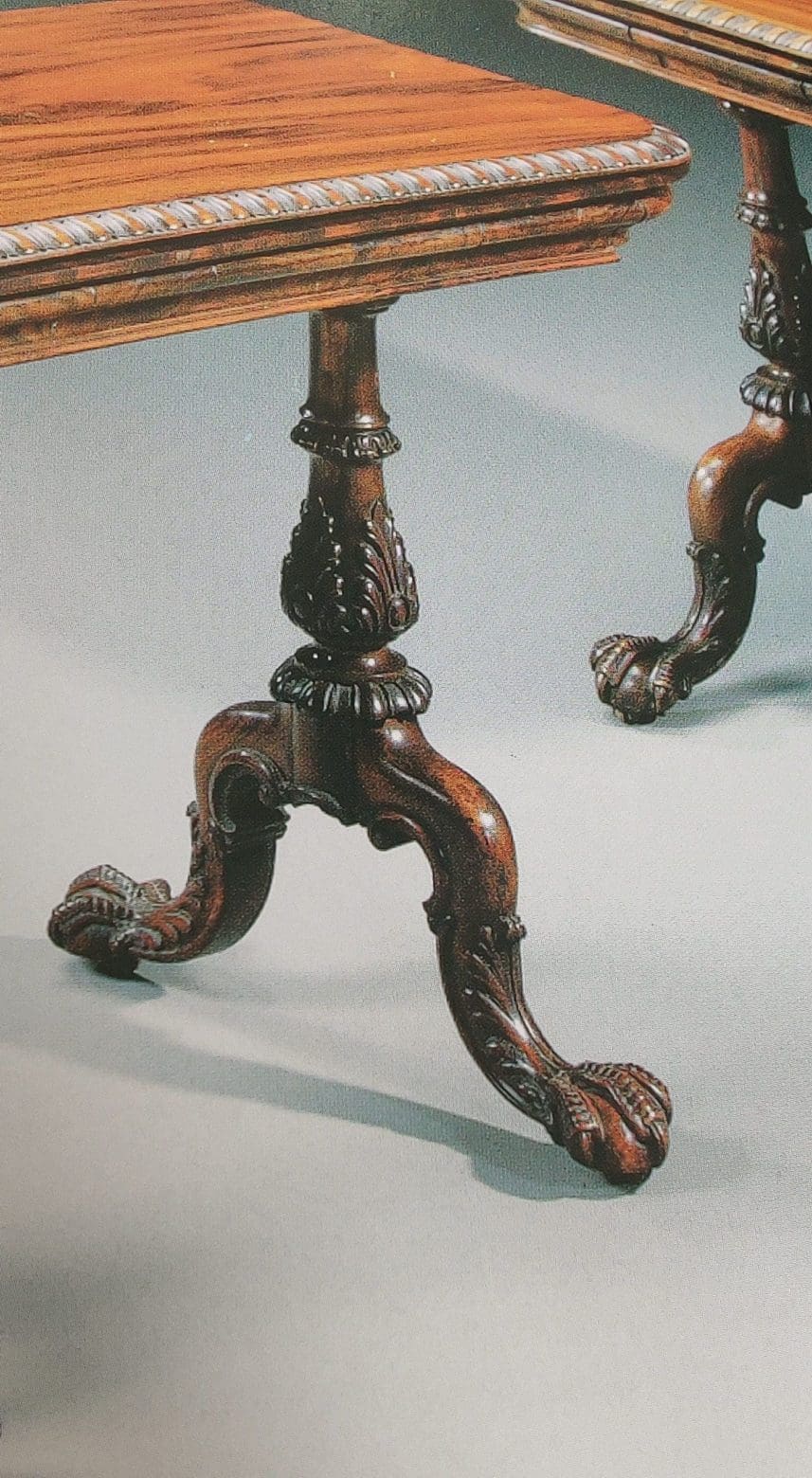 Gillows Extending Quarter Sawn Oak Circular Dining Table with carved claw feet and detailed quarter-sawn oak base.