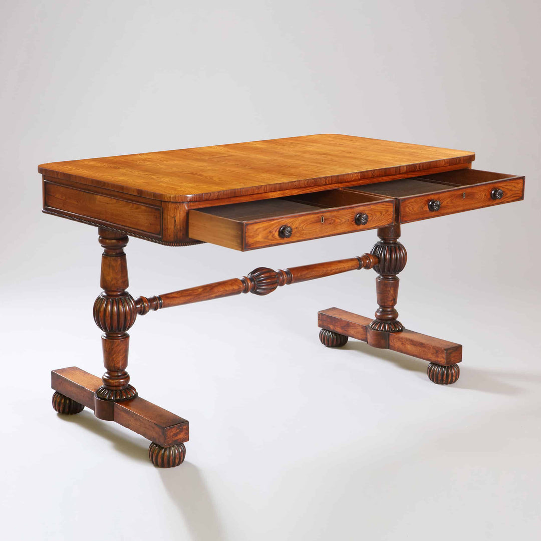William IV Kingwood End Support Writing Table with two drawers, turned stretcher, and gadrooned bun feet, circa 1840 England.