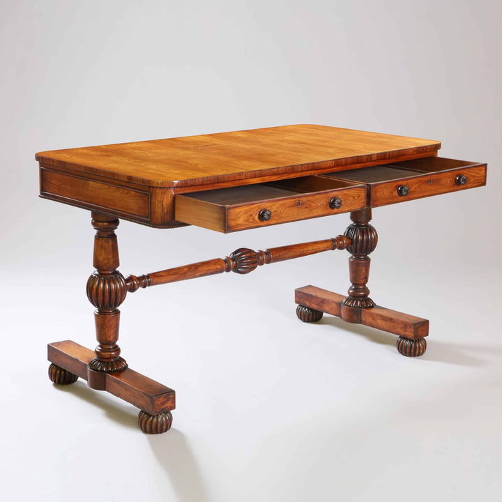William IV Kingwood End Support Writing Table with two drawers, turned stretcher, and gadrooned bun feet, circa 1840 England.