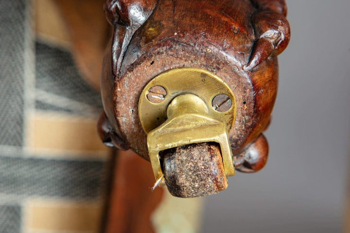 Close-up of a brass castor on carved mahogany cabriole leg from Collection CK20 Victorian library chair.