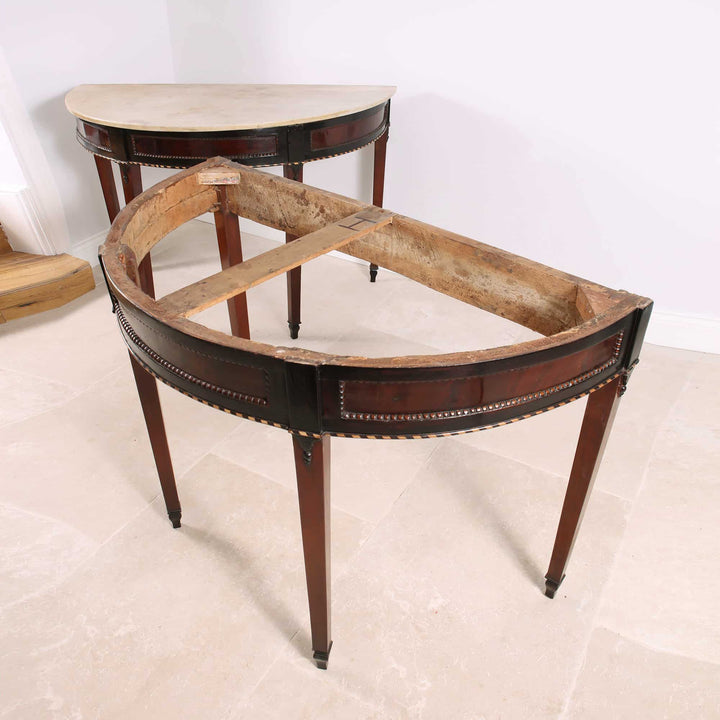 Pair of Neapolitan Demi Lune Console Tables with white marble tops and ebonised mahogany detailing circa 1790.