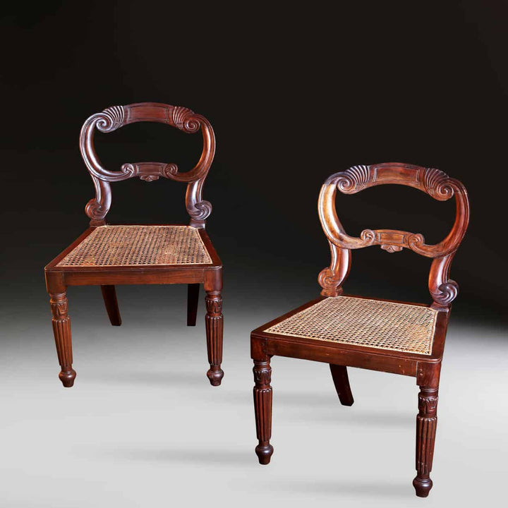 Pair of 19th century South Indian side chairs with cane seats and carved wood frames from Collection EE30.