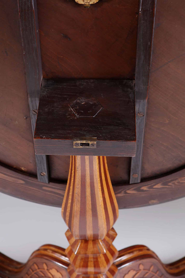 Jamaican Tilt Top Centre Table In the Manner of Ralph Turnbull showing underside of wood and striped leg detail.