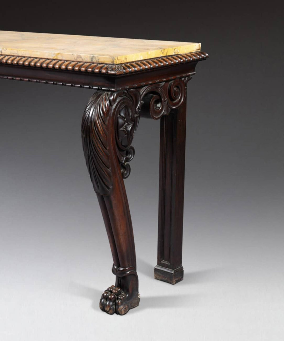 Regency Console Table in The Manner of Thomas Hope with dark mahogany, zoomorphic legs, and yellow Siena marble top.
