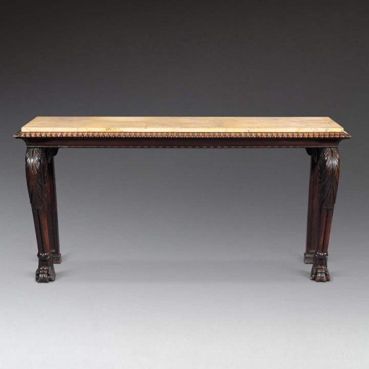 Regency Console Table in The Manner of Thomas Hope with mahogany base and yellow Siena marble top, circa 1820.