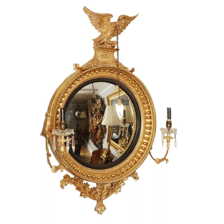 Fine English 19th Century Regency Convex Mirror with gilt eagle, acanthus leaves, candle arms, and decorative mouldings.