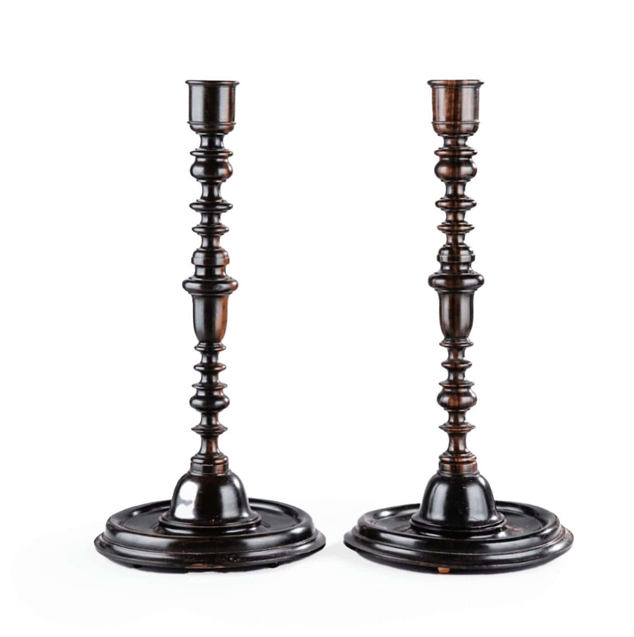 Pair of Turned Ebony Baroque Candlesticks by Andrew Allfree with dark wood and intricate design, circa modern.