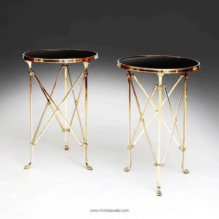 Pair of Mid-Century Roman End Tables with burnished brass legs, lion paw feet, and black Belgian marble tops.