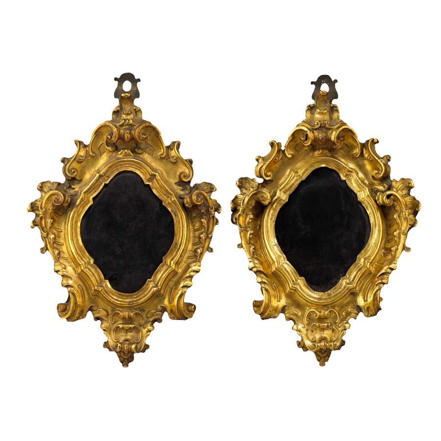 A pair of 17th century Italian gilt bronze baroque picture frames by Nicholas Wells Antiques with ornate scroll details