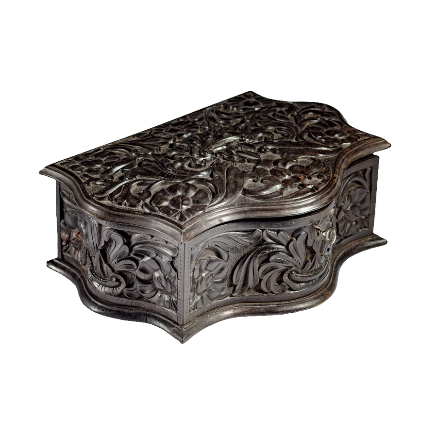 Mid 19th century carved ebony workbox with intricate floral details by Nicholas Wells Antiques, Southern Ceylon circa 1850