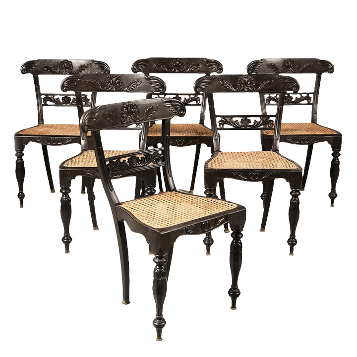 Set of six Anglo Indian ebony side chairs with carved foliate details and caned seats by Collection EE30