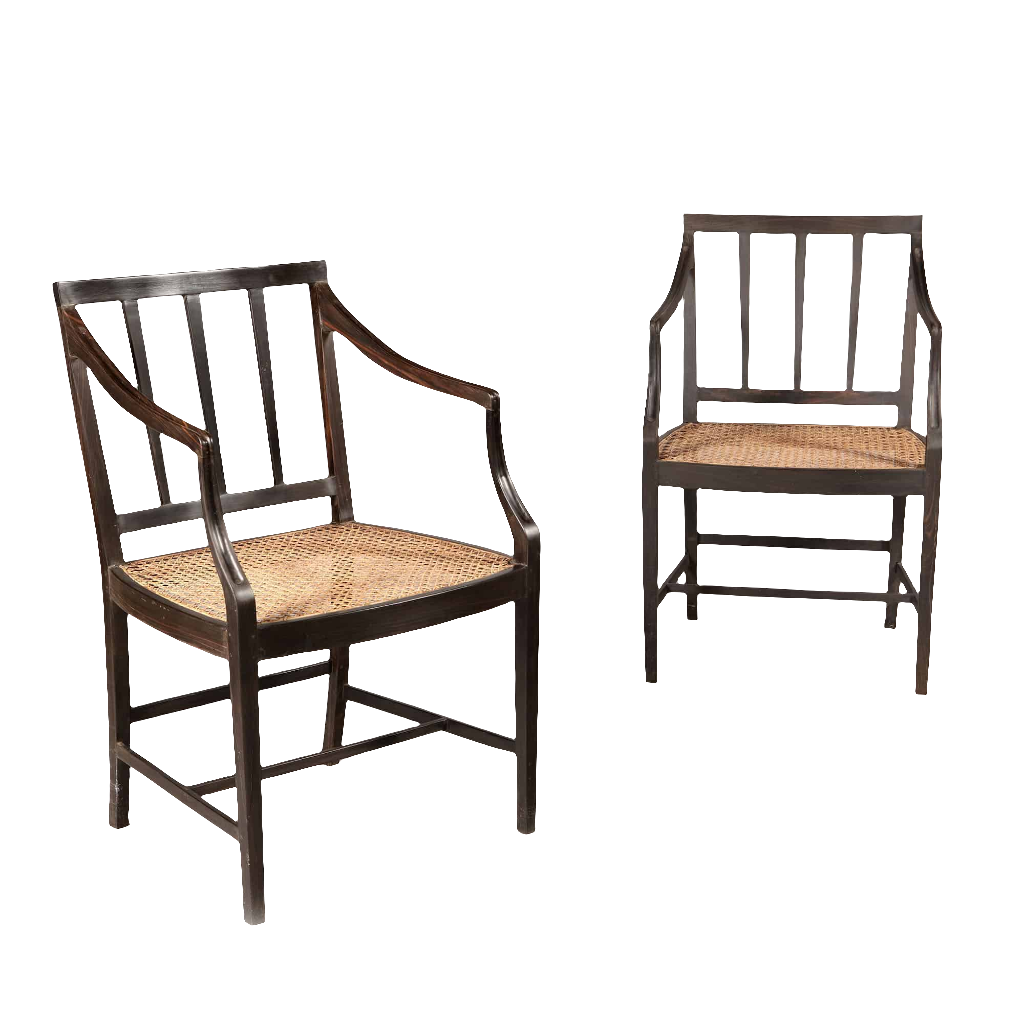 Two solid ebony Anglo Indian dining chairs with caned seats by Collection EE30, circa 2000 craftsmanship.