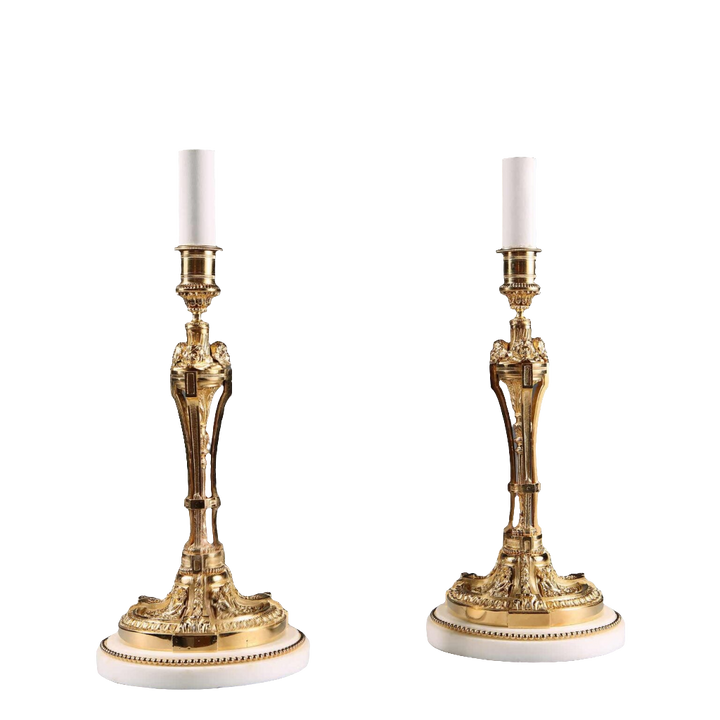 Pair of French Gilt Bronze Neo Classical Candlestick Table Lamps with white marble bases, circa 1880, 30 cm tall.