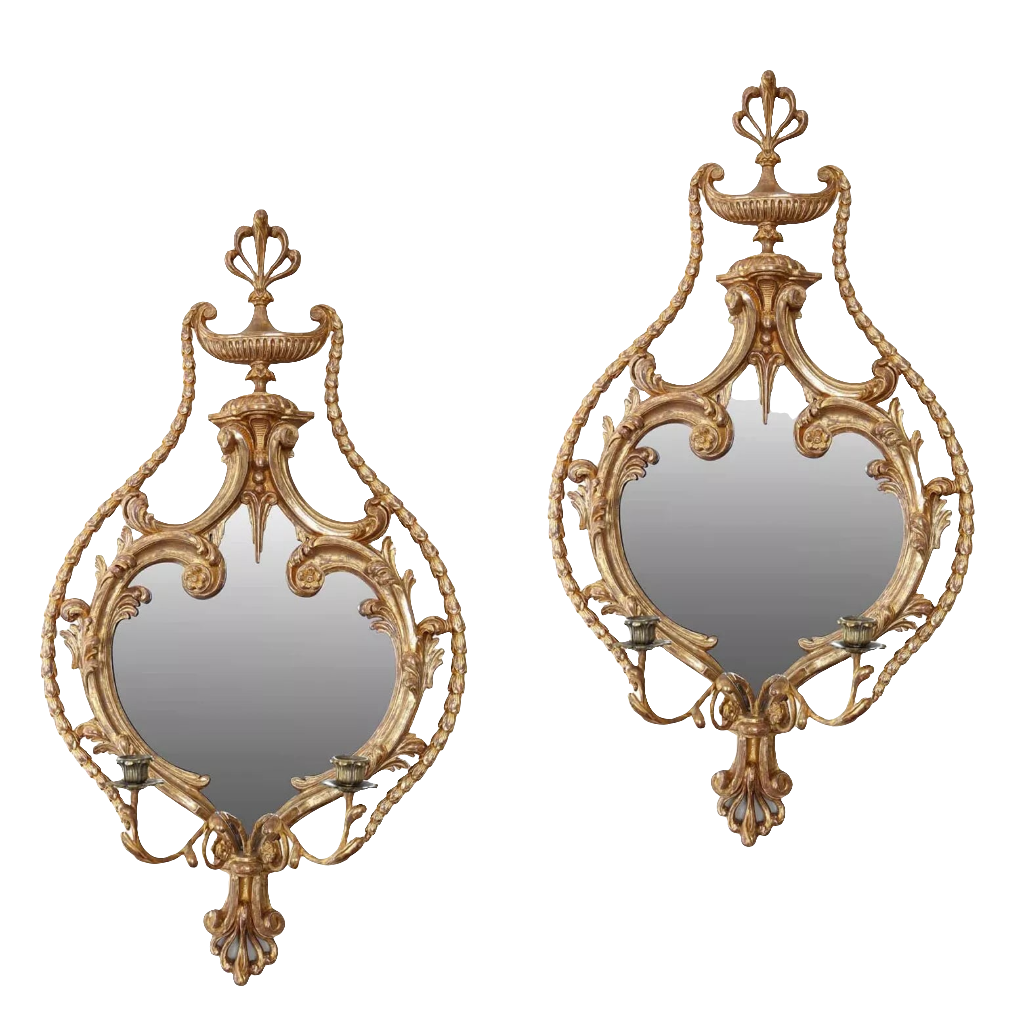 A fine pair of giltwood girandoles, English, 19th Century, in the manner of William France with ornate carvings and mirrors.