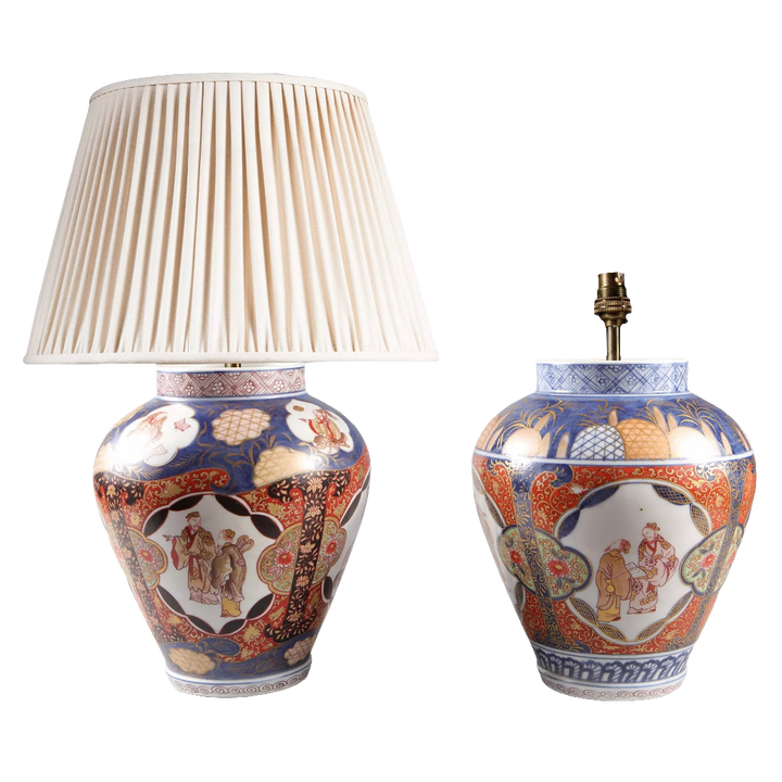 Near Pair of Japanese Imari Vases as Lamps with traditional blue, red, and gold porcelain design circa 1890, one with lamp shade.