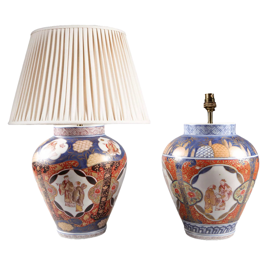 Near Pair of Japanese Imari Vases as Lamps with traditional blue, red, and gold porcelain design circa 1890, one with lamp shade.