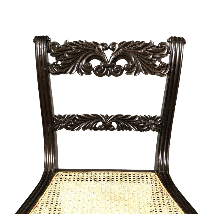 Anglo Indian ebony side chair with intricate foliate carvings and caned seat by Collection EE30