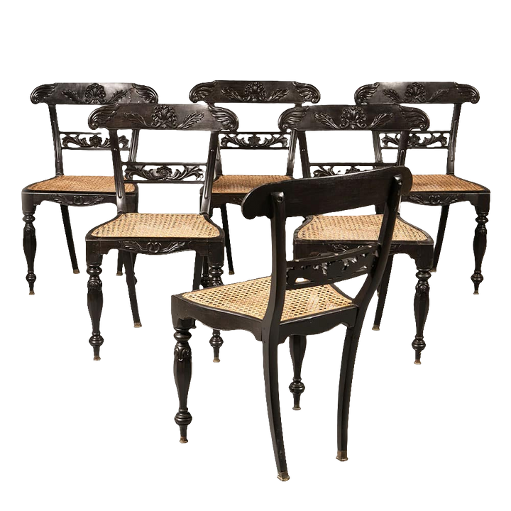 Set of six Anglo Indian ebony side chairs with caned seats and carved details by Collection EE30