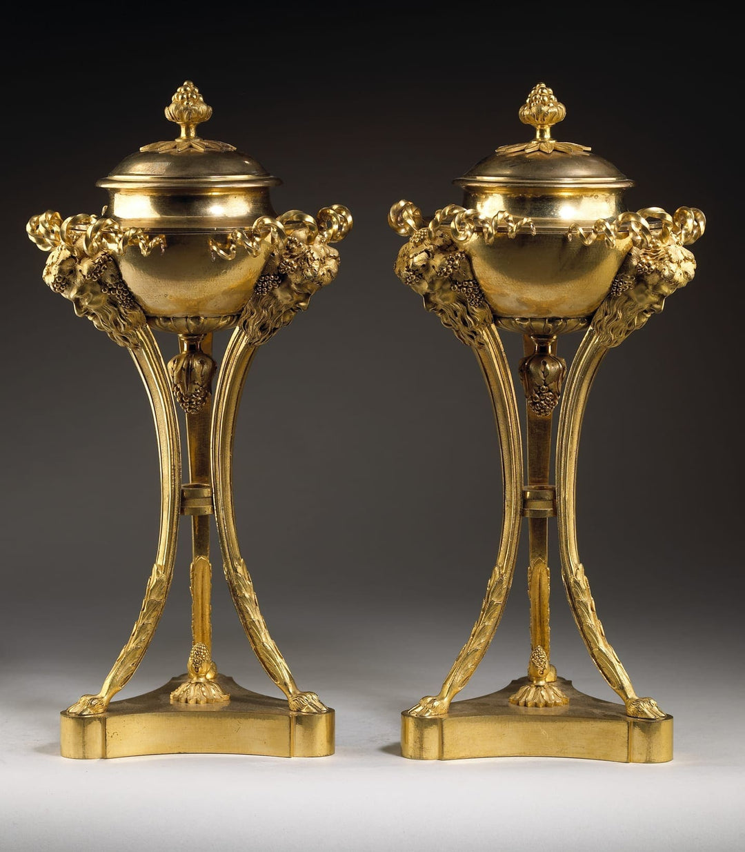 Pair of Louis XVI gilt bronze cassolettes with berry finials and bacchanalian masks by Nicholas Wells Antiques