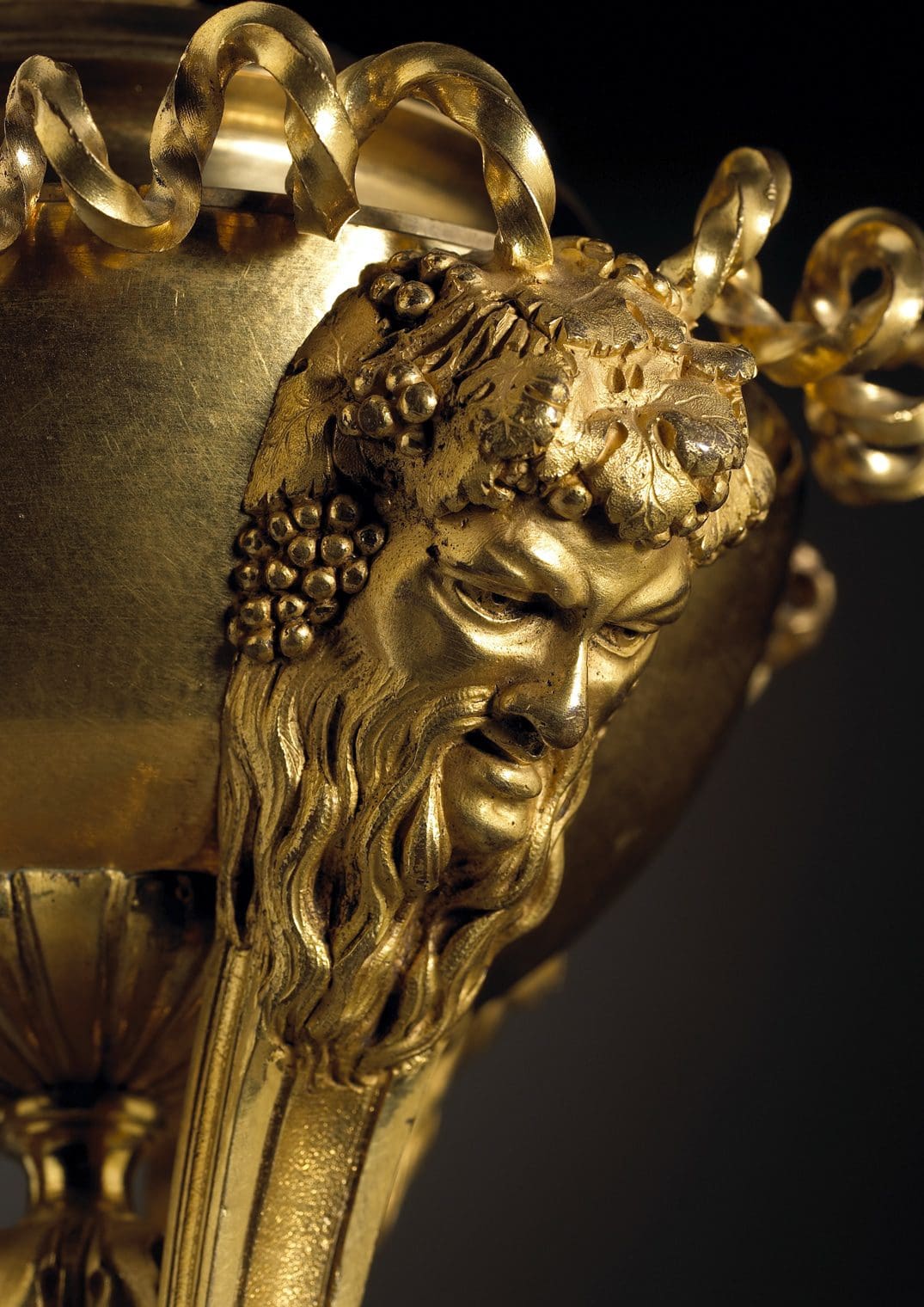 Close-up of gilt bronze Bacchus mask detail on Louis XVI cassolettes by Nicholas Wells Antiques