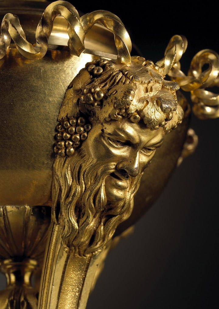 Close-up of gilt bronze Bacchus mask detail on Louis XVI cassolettes by Nicholas Wells Antiques